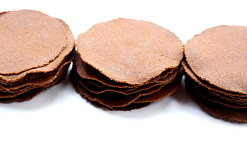 Fermented soybean discs, known as “Thua Nao,” a traditional Thai seasoning used to enhance flavor in Northern cuisine.