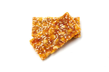 Crispy peanut brittle bars coated in glossy caramel.