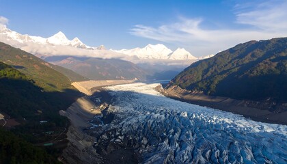 Aerial view of glacial valley, snow-capped mountains