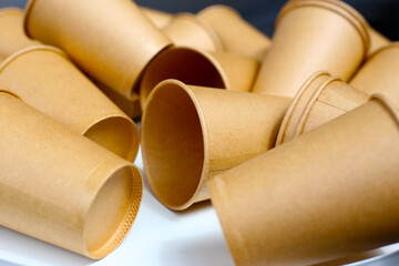 Brown paper cups on white background.
