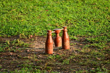 wooden bottle for petanque sport Thai style, equipment on green grass