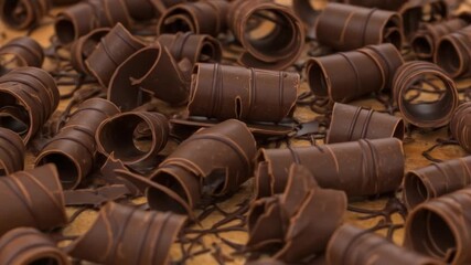 Chocolate curls scattered on a beige surface - Powered by Adobe