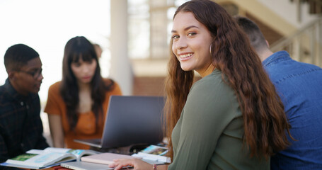Fototapeta premium Smile, university and portrait of woman at campus for education with confidence for studying. Happy, pride and female student with group for learning with college exam, assignment or test outdoor.
