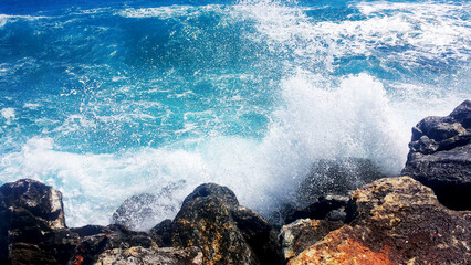 Breaking waves on the rocky coast of the Greek island of Crete