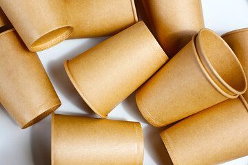 Brown paper cups on white background.