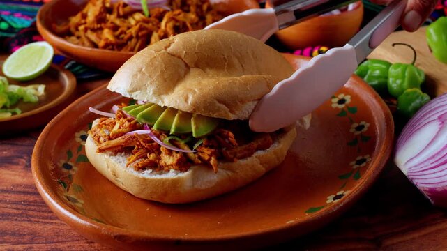  Mexican food, preparing a Mexican torta sandwich with cochinita pibil