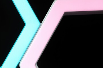 Abstract image of intersecting pastel hexagons on a black background