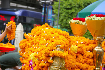 Marigold garlands offered for worship at the Erawan Shrine in Bangkok, Thailand.