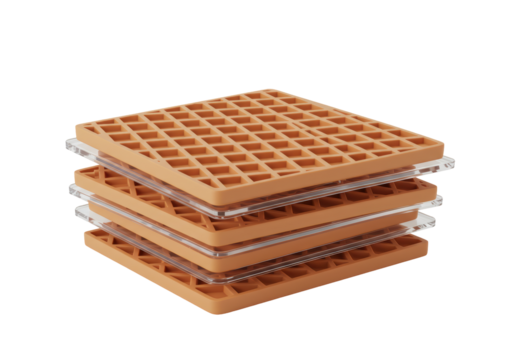 Isolated stack of four light brown waffle or honeycomb grids with clear acrylic spacers