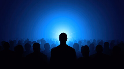 Fototapeta premium Crowd of silhouettes stands front of bright blue light, creating dramatic and mysterious atmosphere. image evokes feelings of anticipation and curiosity, as figures appear to be focused light