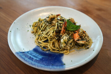 Close up plate of Spaghetti pasta with shrimp Pesto sauce