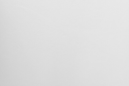 Calm simple white background with soft texture. light gray material looks like clean plaster wall for minimalist house providing feeling of tranquility