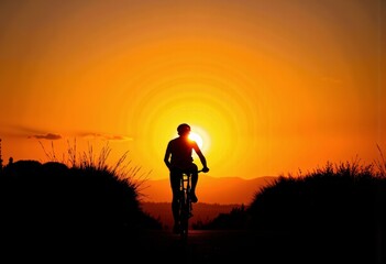 Silhouette of Cyclist Pedaling with Vibrant Orange Sunset in Background Creating a Dramatic Contrast on Serene Scenic Outdoor Journey