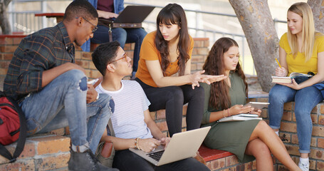 Obraz premium People, students and talk with laptop at campus for education, research and group project. Friends, pc and textbook for learning, university scholarship and studying information for exam preparation