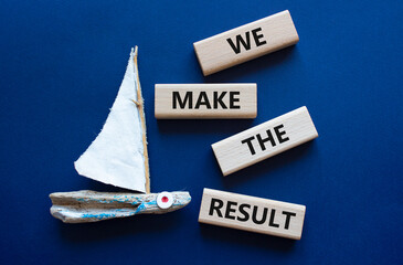 We make the result symbol. Concept words We make the result on wooden blocks. Beautiful deep blue...