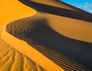 Golden desert sand dunes, textured ridges, sunlit curves