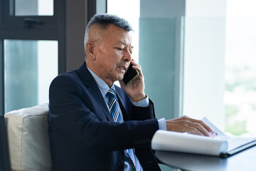 Asia businessman working with paper work at office	