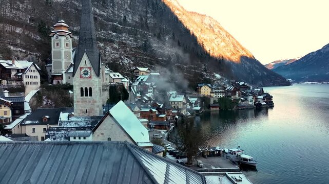 Aerial view of the iconic village of Hallstatt in witer at sunrise.