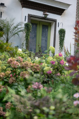 Elegant Floral Shopfront with Lush Greenery and Blooming Flowers