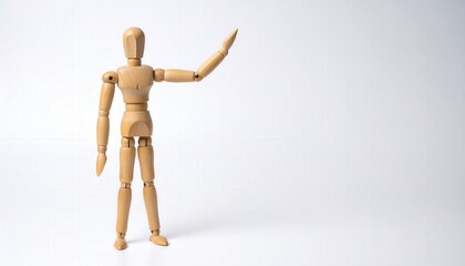 A wooden mannequin strikes a pose with arm extended, its form and structure, poised against a simple backdrop.