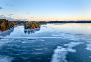 sunset on the icy lake in winter
