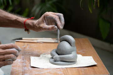  crafting an eco-friendly clay Ganesh idol for Ganesh Chaturthi 
