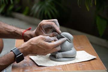  crafting an eco-friendly clay Ganesh idol for Ganesh Chaturthi 
