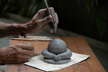  crafting an eco-friendly clay Ganesh idol for Ganesh Chaturthi 
