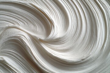 Abstract swirls of off-white, smooth substance