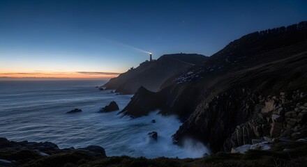 Lighthouse at Night on Rocky Coast
