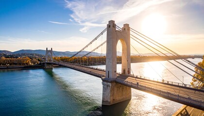 Fototapeta premium Scenic bridge over a river at sunset