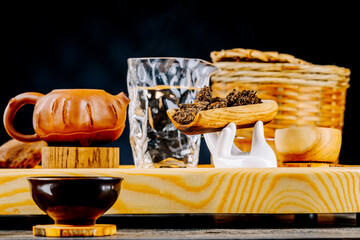Chinese Pu-erh tea on a wooden stand. Tea ceremony