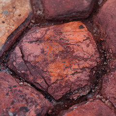 A Weathered Granite Slab Embedded In Dark Earthy Surface AI generated