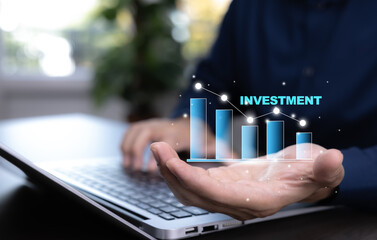 Businessman showing digital investment chart with bar graph and data analytics, symbolizing financial growth, economic planning, and modern investment strategy.