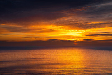 Fototapeta premium Sunset Over Calm Ocean