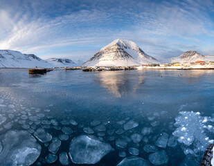 Snow-covered Mountain and Frozen Harbor
