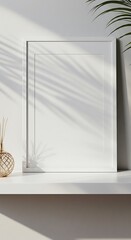 光と影の静物画 白い額縁と植物の影