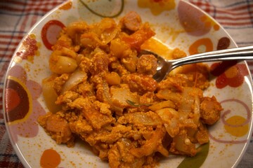 Homemade Hungarian vegetable stew, lecsó, served in a bowl, close-up view.