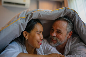 Couple is sleeping at bedroom.