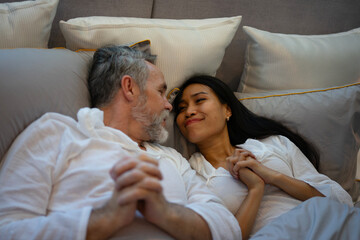 Couple is sleeping at bedroom.