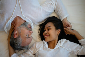 Couple is sleeping at bedroom.