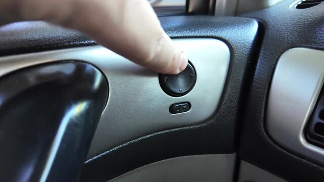 analog car buttons. Man finger pressing play button on vintage tape player. close up finger pressing off button on car climate control panel to disable ac while illuminated recirculation