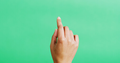 Hand, click and mockup space in studio, gesture and point with scroll, empty and green background. Person, finger and interface or responsive display with user experience, touch and virtual screen