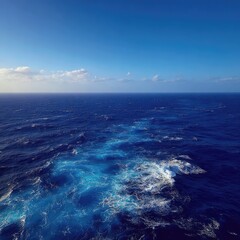 Expansive ocean view, blue water, wake