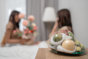 A warm moment with beautiful flowers and decorative fruits in a cozy indoor setting