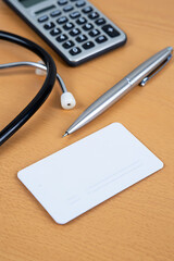 Health Insurance Card Pen Calculator Stethoscope Light Surface