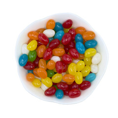 Assorted jelly beans in a white bowl, top view, isolated transparent png