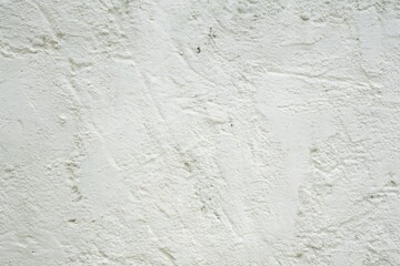 Fototapeta premium Off white stucco wall texture with subtle shadows and imperfections detail