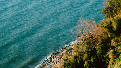 rocky coastline overlook with calm blue sea