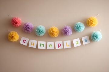 A "Feliz cumplea?+/-os" sign written in colorful paper flowers against a soft background